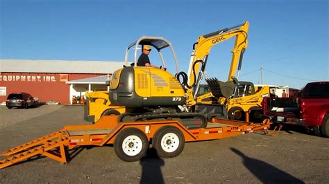 mini excavator loaded in a pickup truck|mini flatbed truck haul.